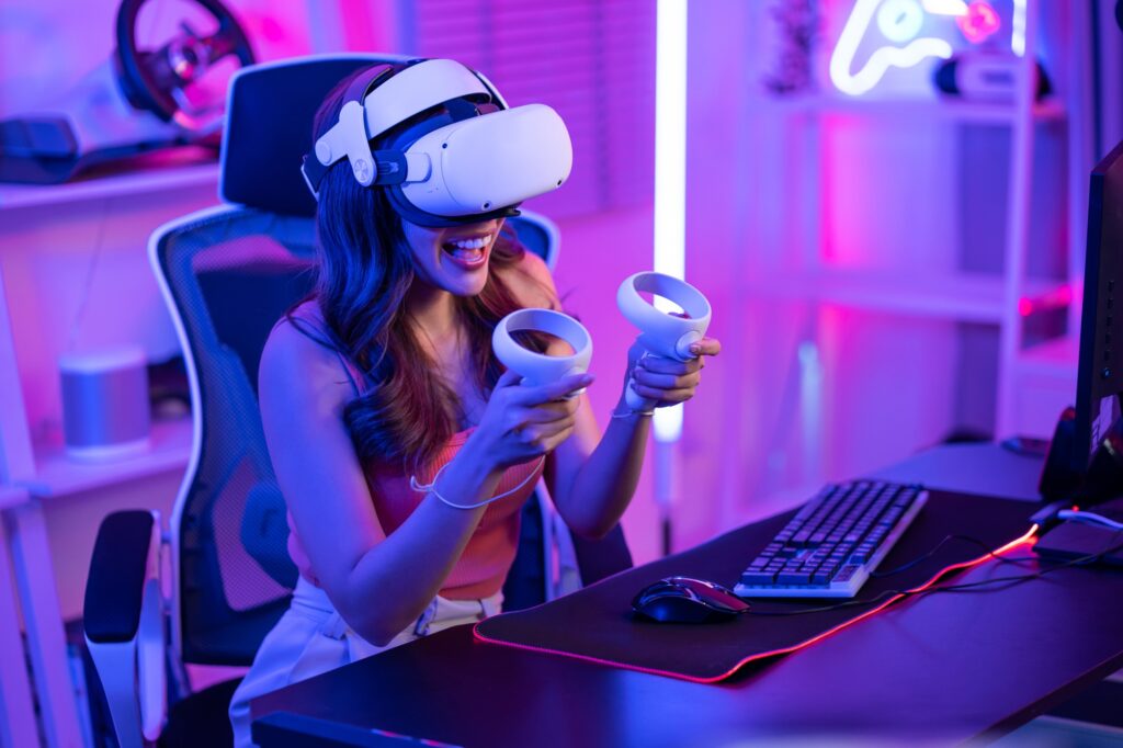 asian young esport woman gamer use technology vr glasses and play game