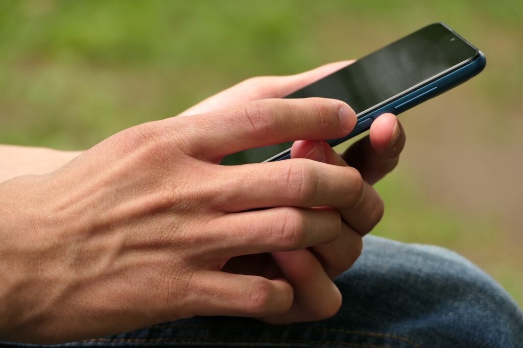cell phone smartphone in the hands of a man