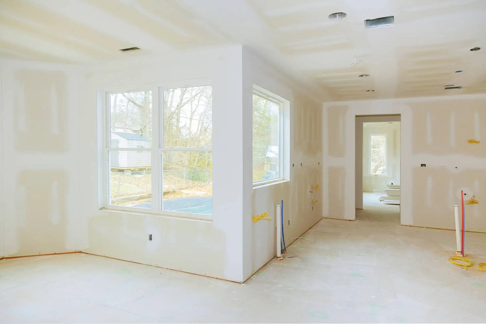 interior construction of housing project with drywall installed and patched without painting applied