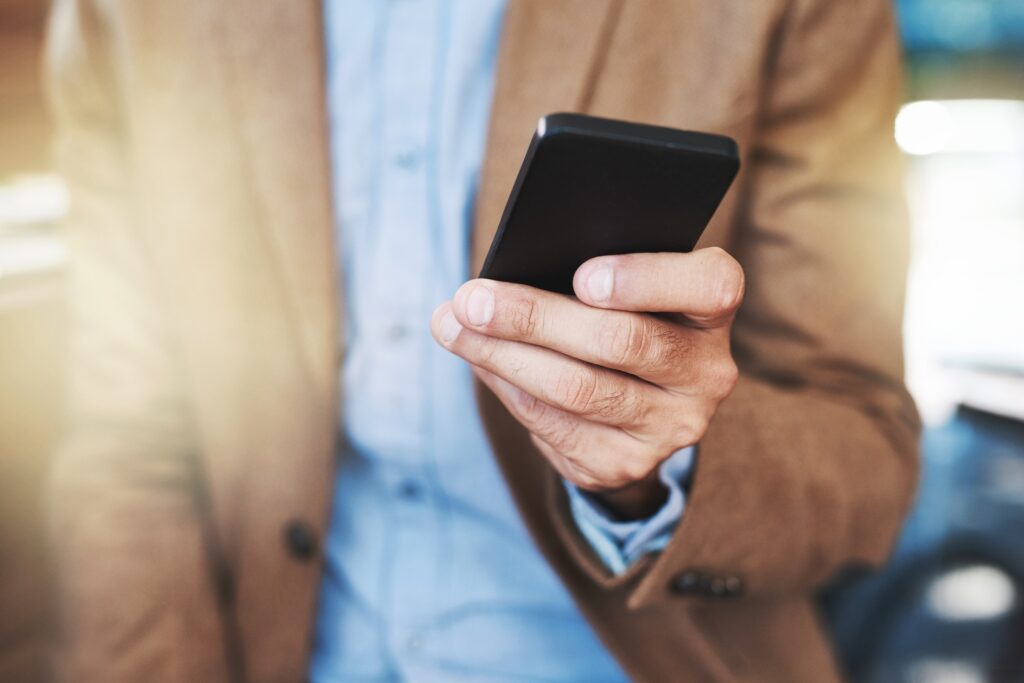 making the android connection cropped shot of a businessman using a mobile phone