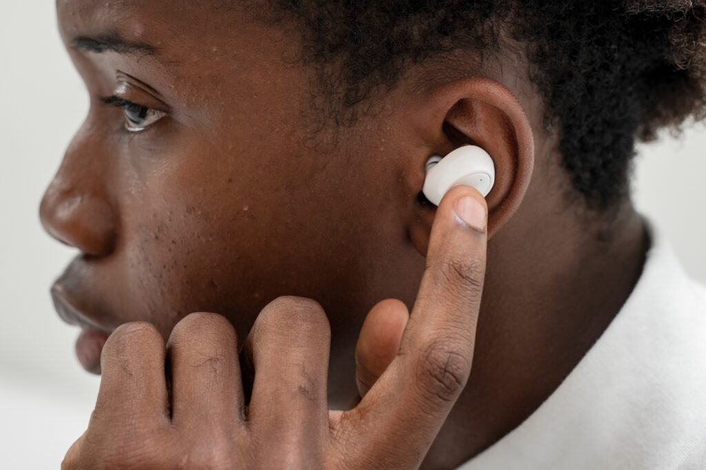 on the phone with wireless earbuds