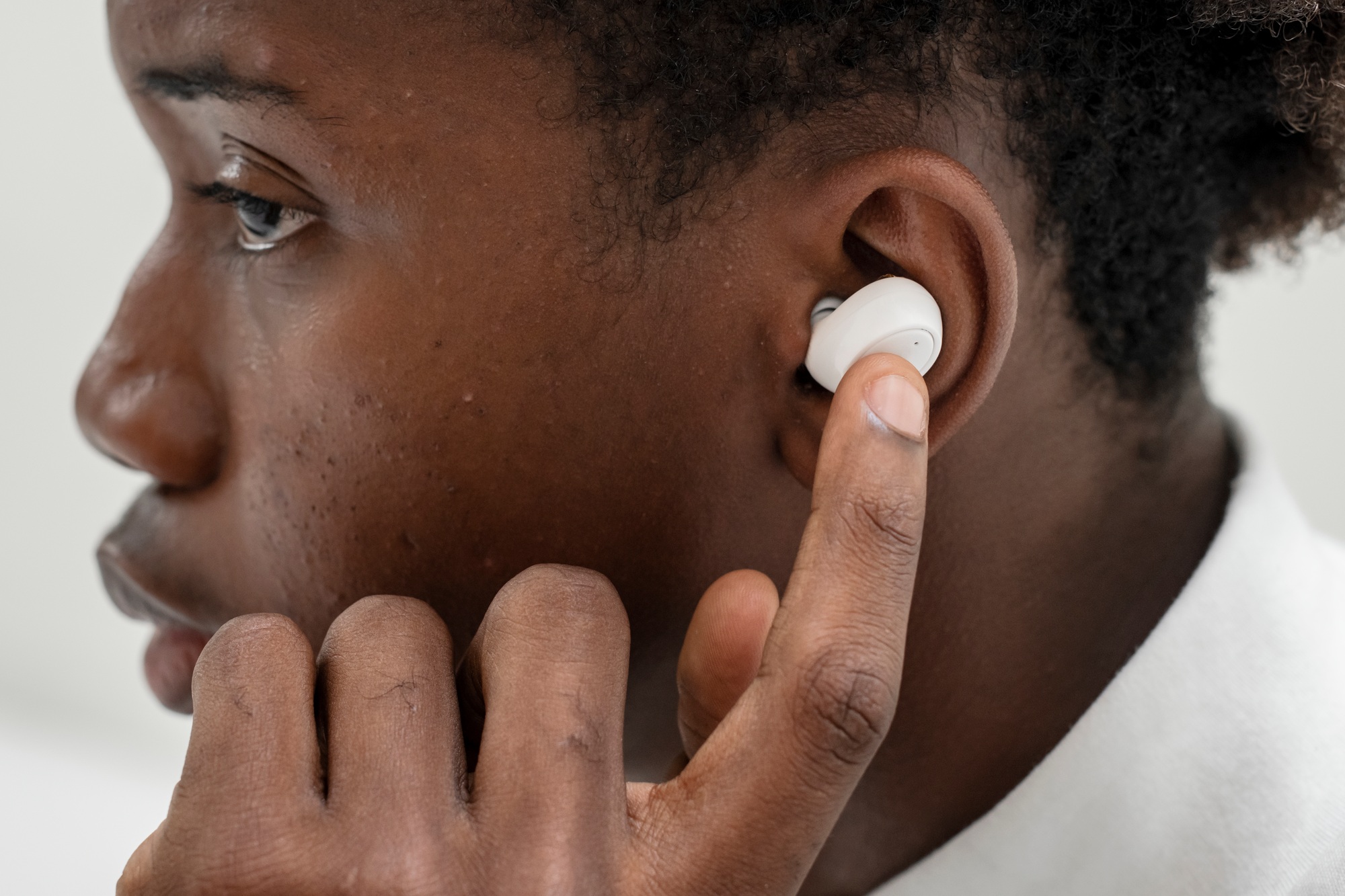 on the phone with wireless earbuds